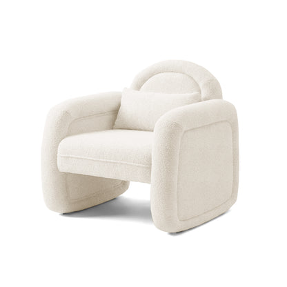 Cream-colored plush armchair with lumbar pillow on white background
