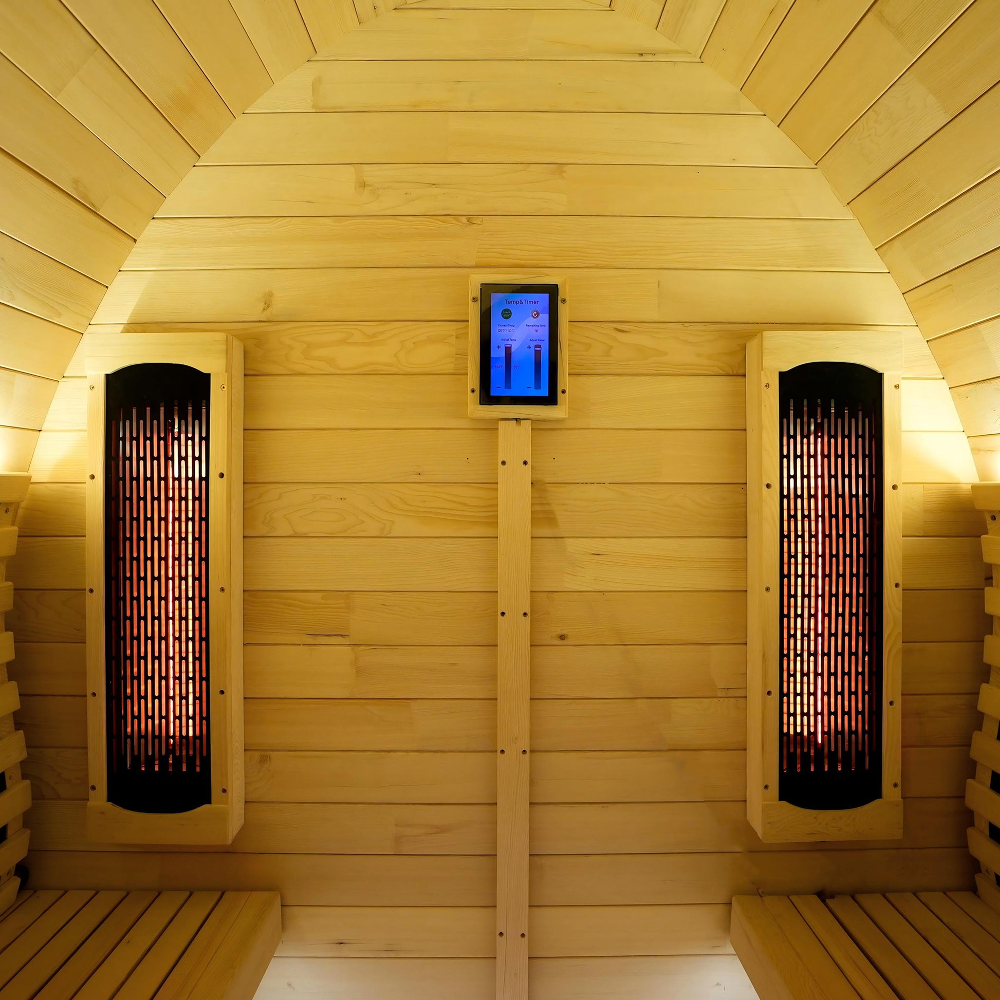 Interior wooden sauna with vertical heaters and partial seating area