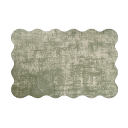 Rectangular scalloped-edge area rug in muted sage green on a white background.