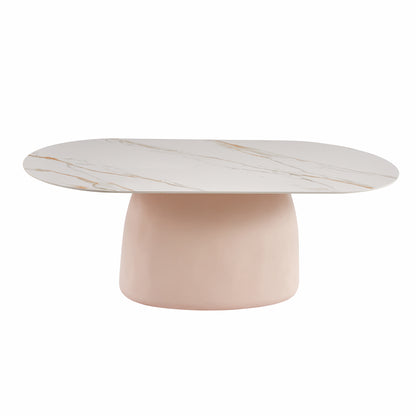 Contemporary oval coffee table with white marble-effect top and blush pink base on white background