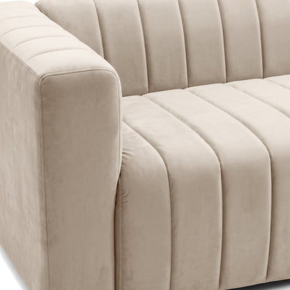 Close-up partial view of the left side of a beige sofa