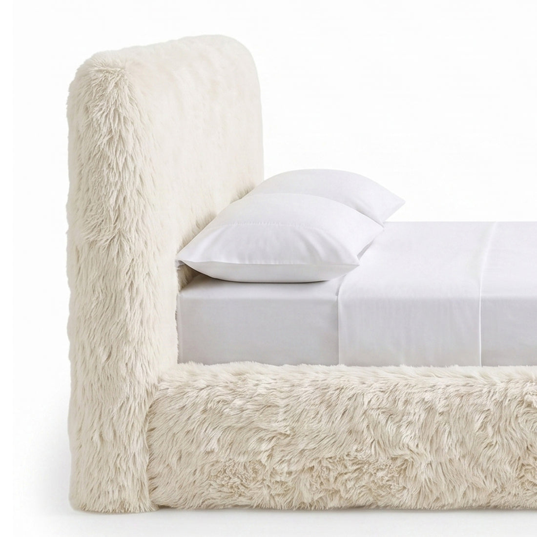 Close partial view of a cream faux-fur upholstered bed.