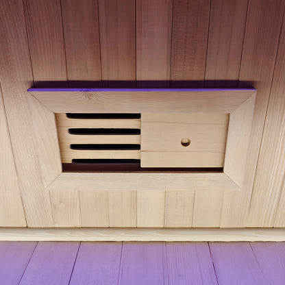 Close-up of a wooden adjustable vent panel in a sauna wall