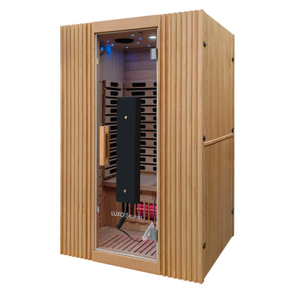 Freestanding infrared sauna made of light-colored wood on a white background.