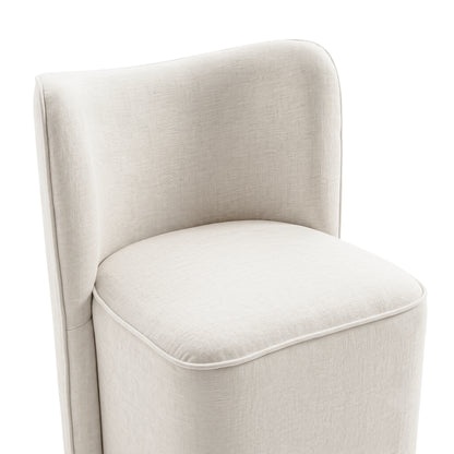 Close view of the seat and back of a cream upholstered chair on white background