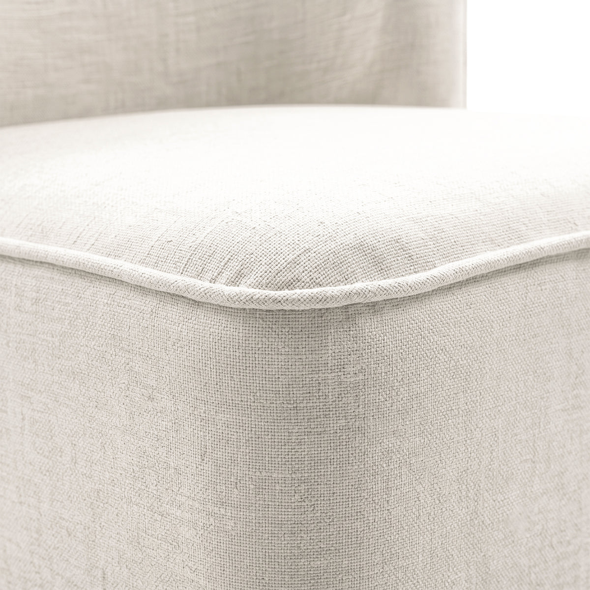 Close-up of light upholstered fabric and stitching detail