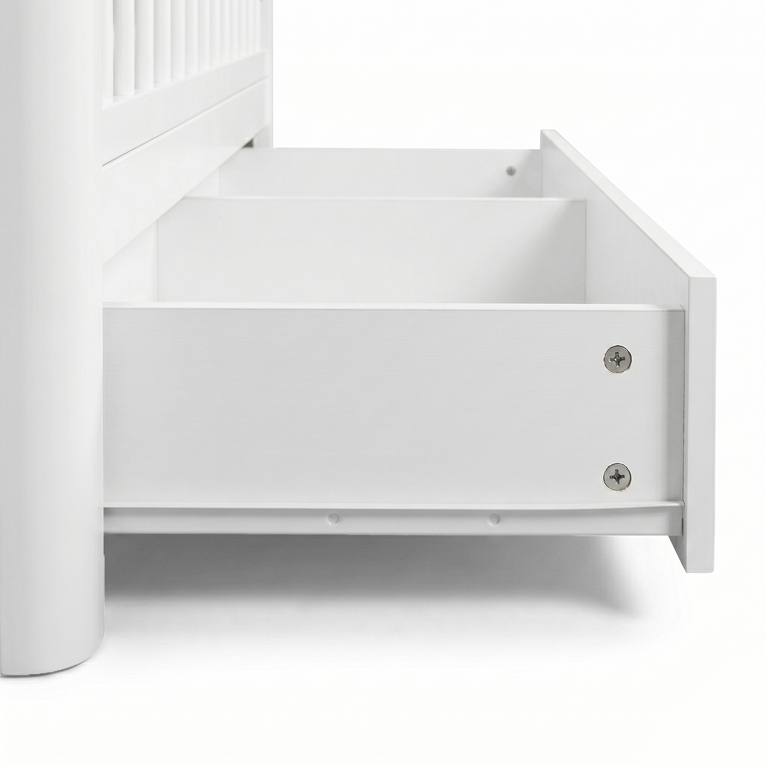 Close-up of crib drawer hardware and base