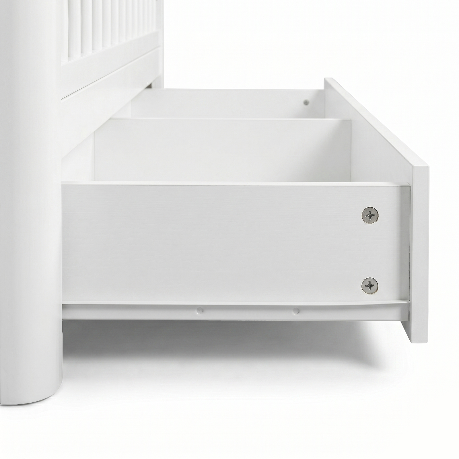 Close-up of crib drawer hardware and base