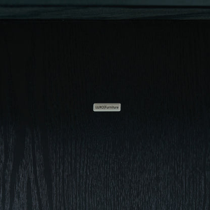 Close-up of branded metal nameplate on dark wood surface
