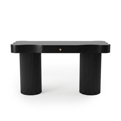 Black desk or console table with rounded corners and fluted legs on a white background
