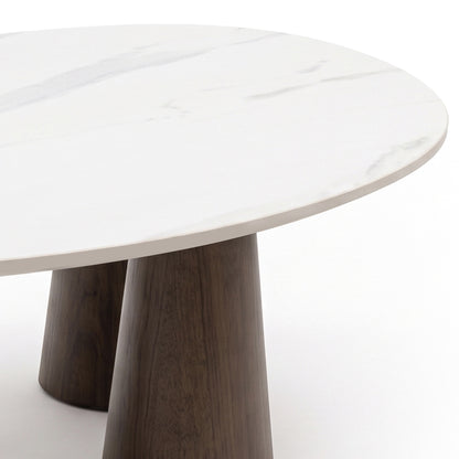 Partial view of a modern table with white top and wooden legs on a white background