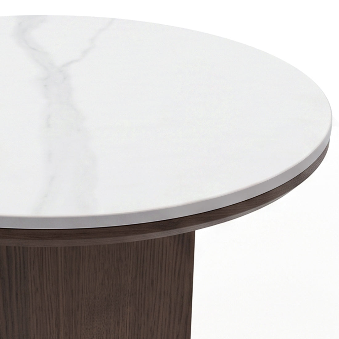 Close-up of the edge and top surface of a round table with a white marble-like finish and wood base on a white background