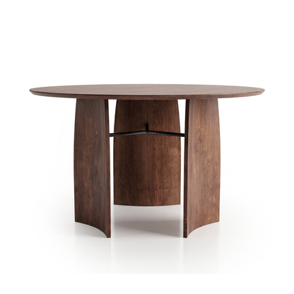 Round wooden table on a white background with a unique curved-leg base