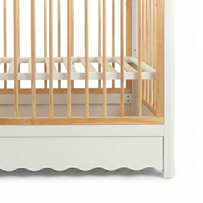 Close-up of baby crib corner detail on white background