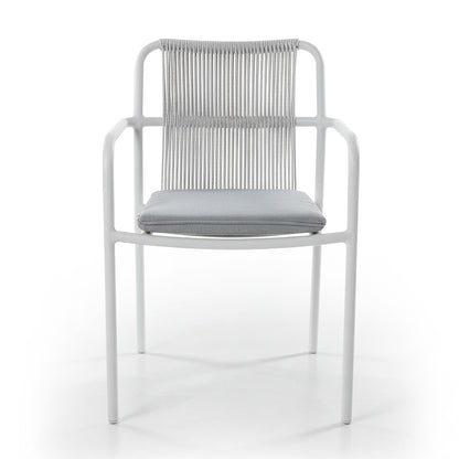 Evone 4 Seater Stone Outdoor Dining Table Set features a sleek stone tabletop and four modern armchairs with a slim white frame and woven-cord backrest, perfect for stylish alfresco dining.