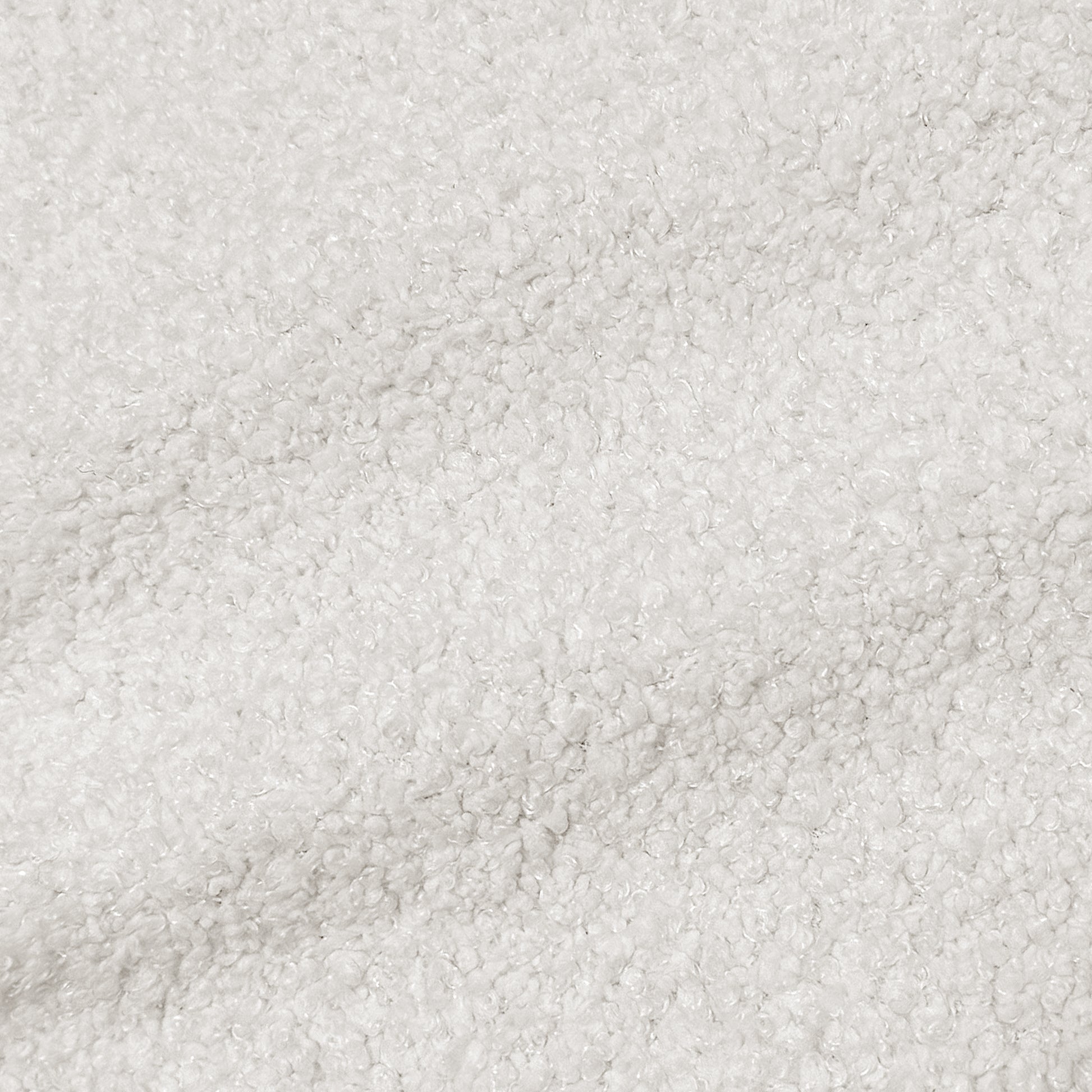 Close-up of white textured sherpa-like fabric
