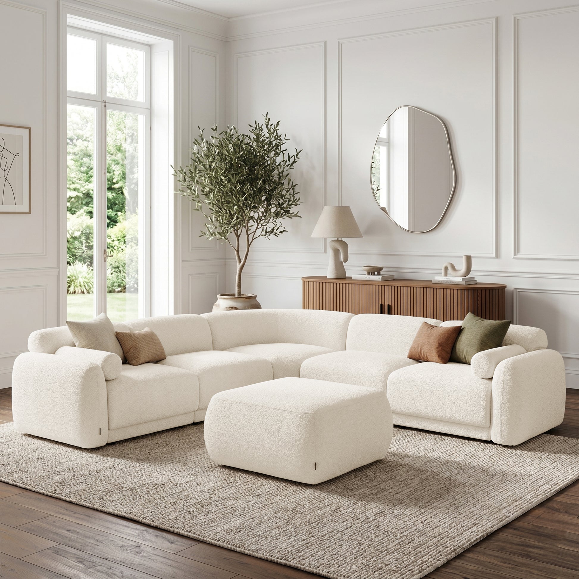 Modular sectional sofa with ottoman in a bright styled living room