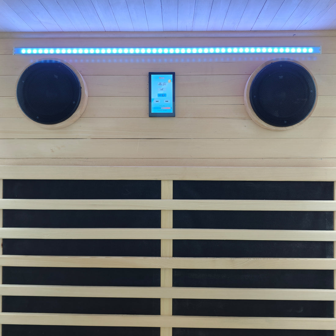 Close-up of sauna interior with speakers, touchscreen, and LED lighting
