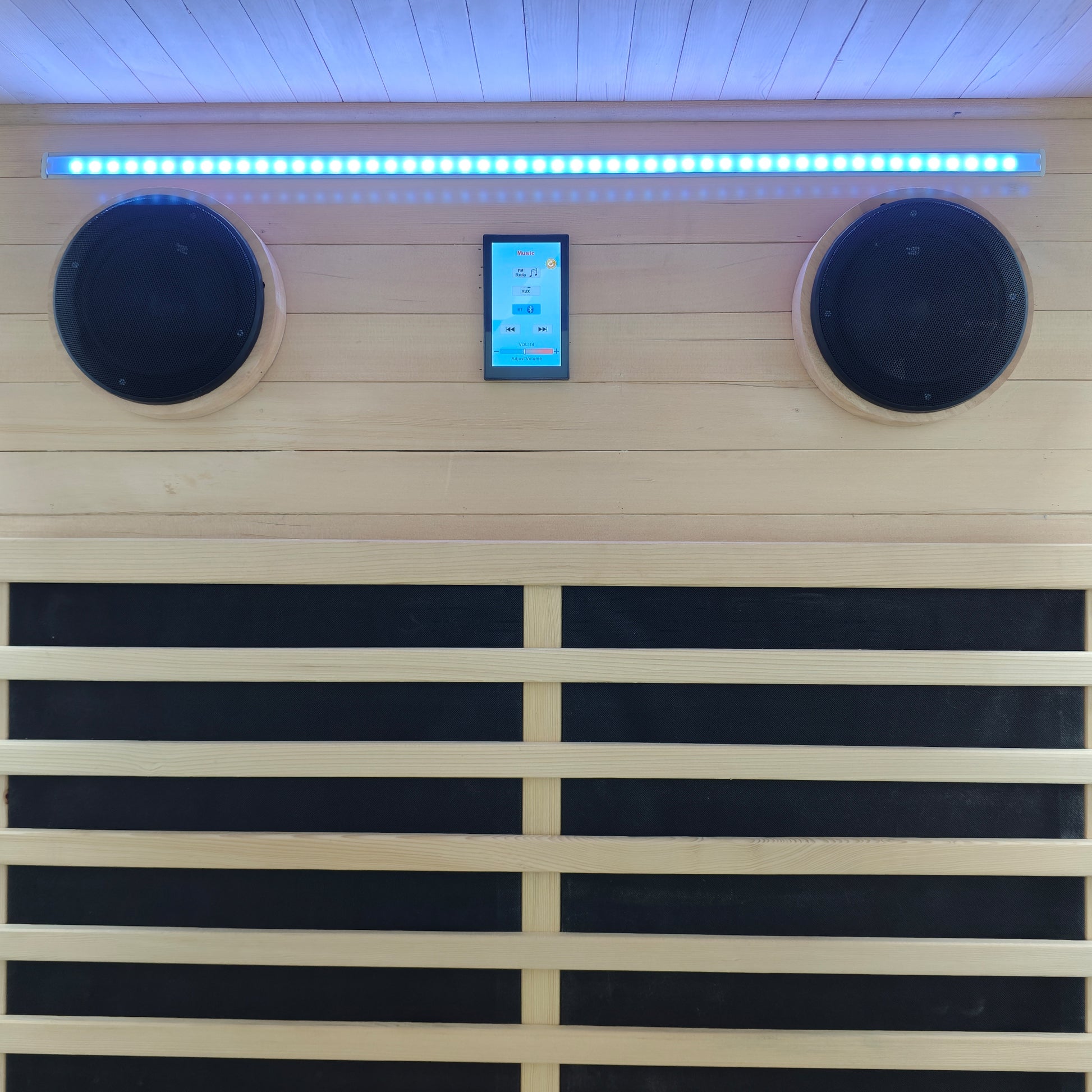 Close-up of sauna interior with speakers, touchscreen, and LED lighting