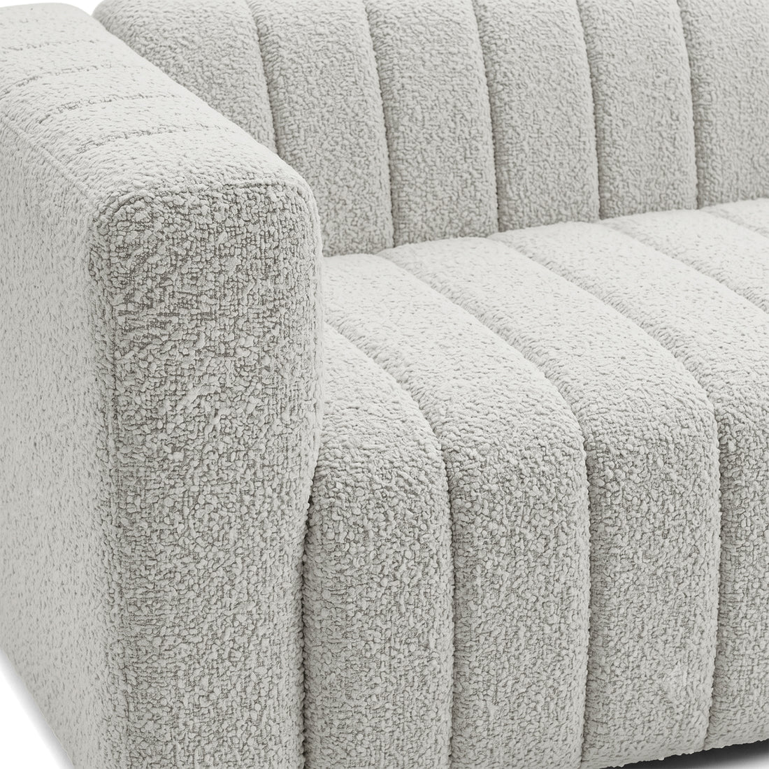 Close-up of a modern sofa arm and seat upholstery