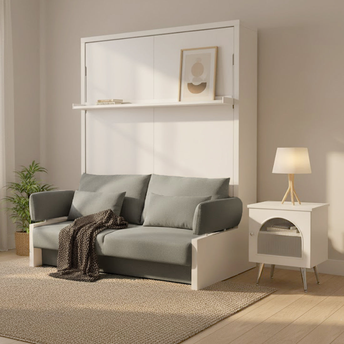 Byron Queen Murphy Bed with Mattress in White & Grey, folded into a white paneled unit with a narrow shelf, complemented by a muted gray-green sofa and a small white side table.