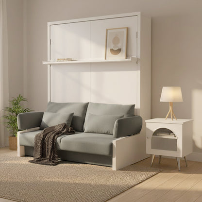 Byron Queen Murphy Bed with Mattress in White & Grey, folded into a white paneled unit with a narrow shelf, complemented by a muted gray-green sofa and a small white side table.