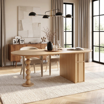 Modern wooden table in a styled room with chairs, rug, and natural light