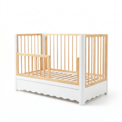 Modern two-tone baby crib with white frame and wood slats on white background