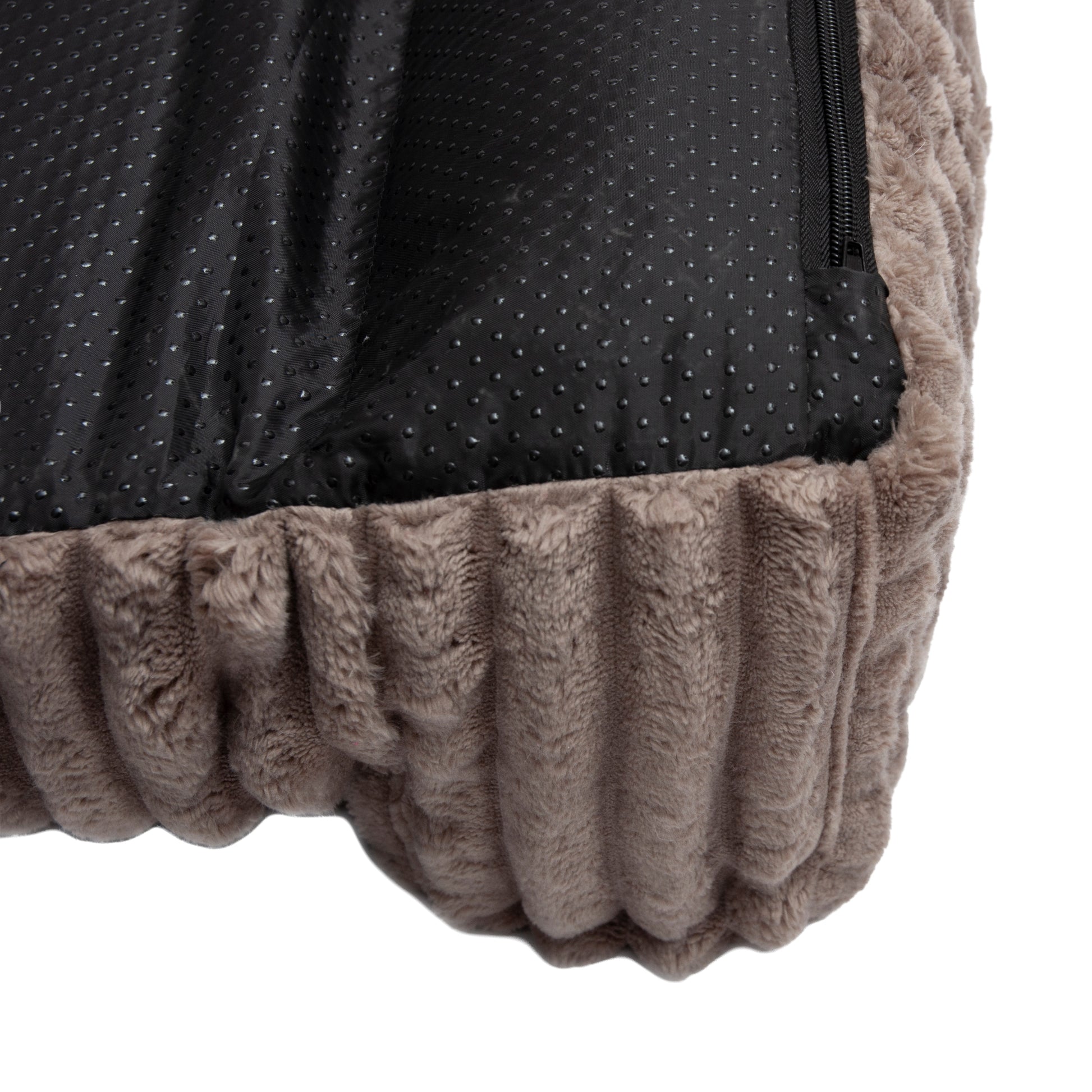 Detail of pet bed corner showing fabric and non-slip underside