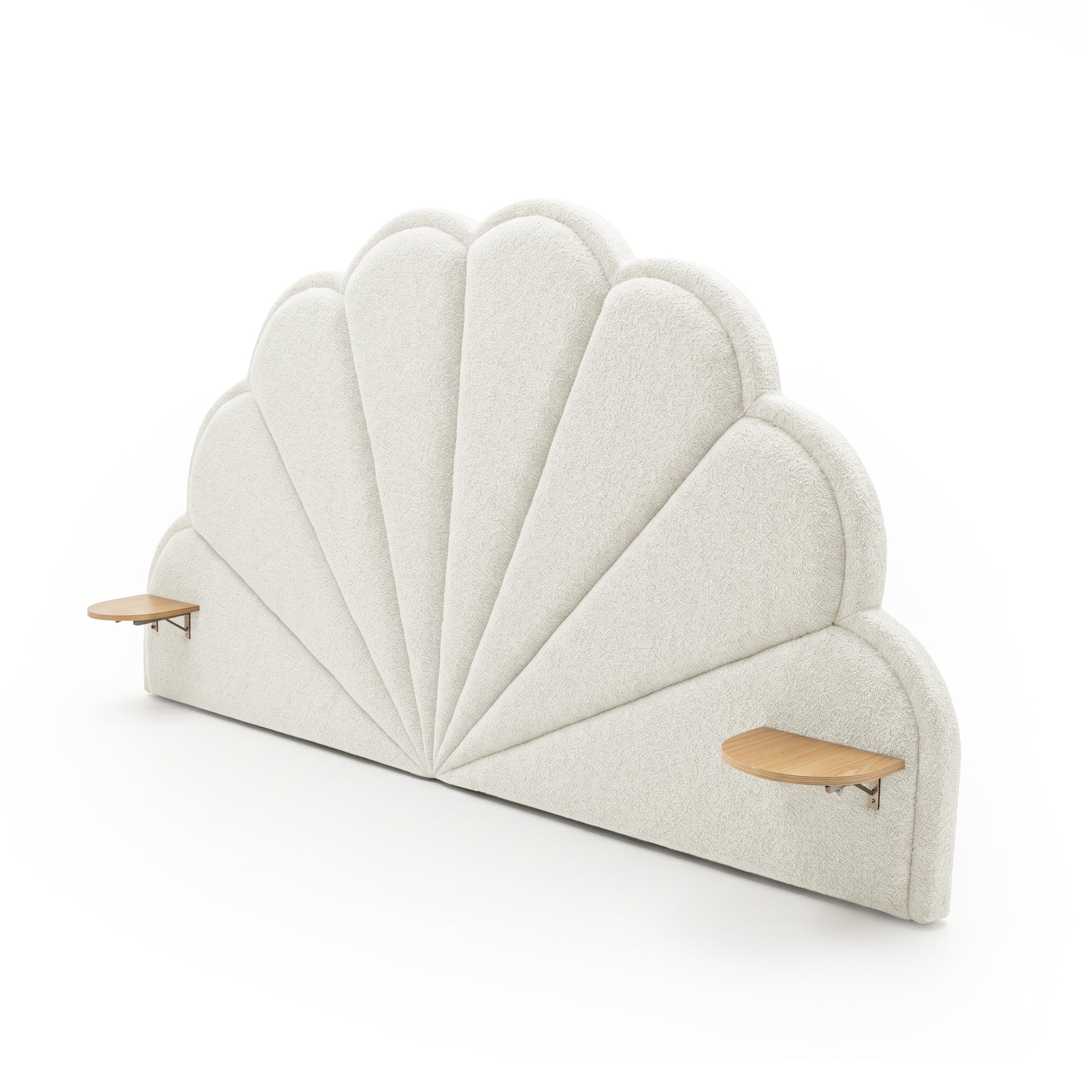 Decorative scalloped upholstered headboard with minimalist floating shelves on white background