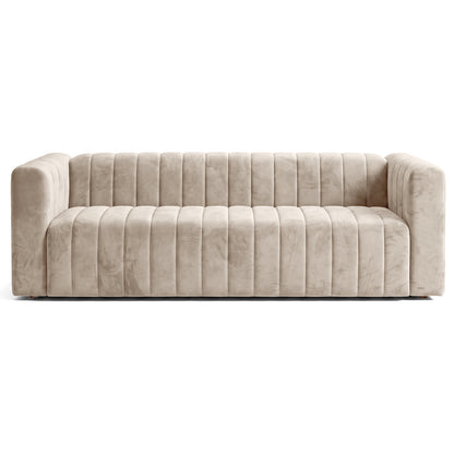 Beige tufted sofa on a white background