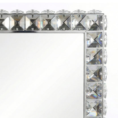 Close-up of crystal-like embellished corner of mirror frame