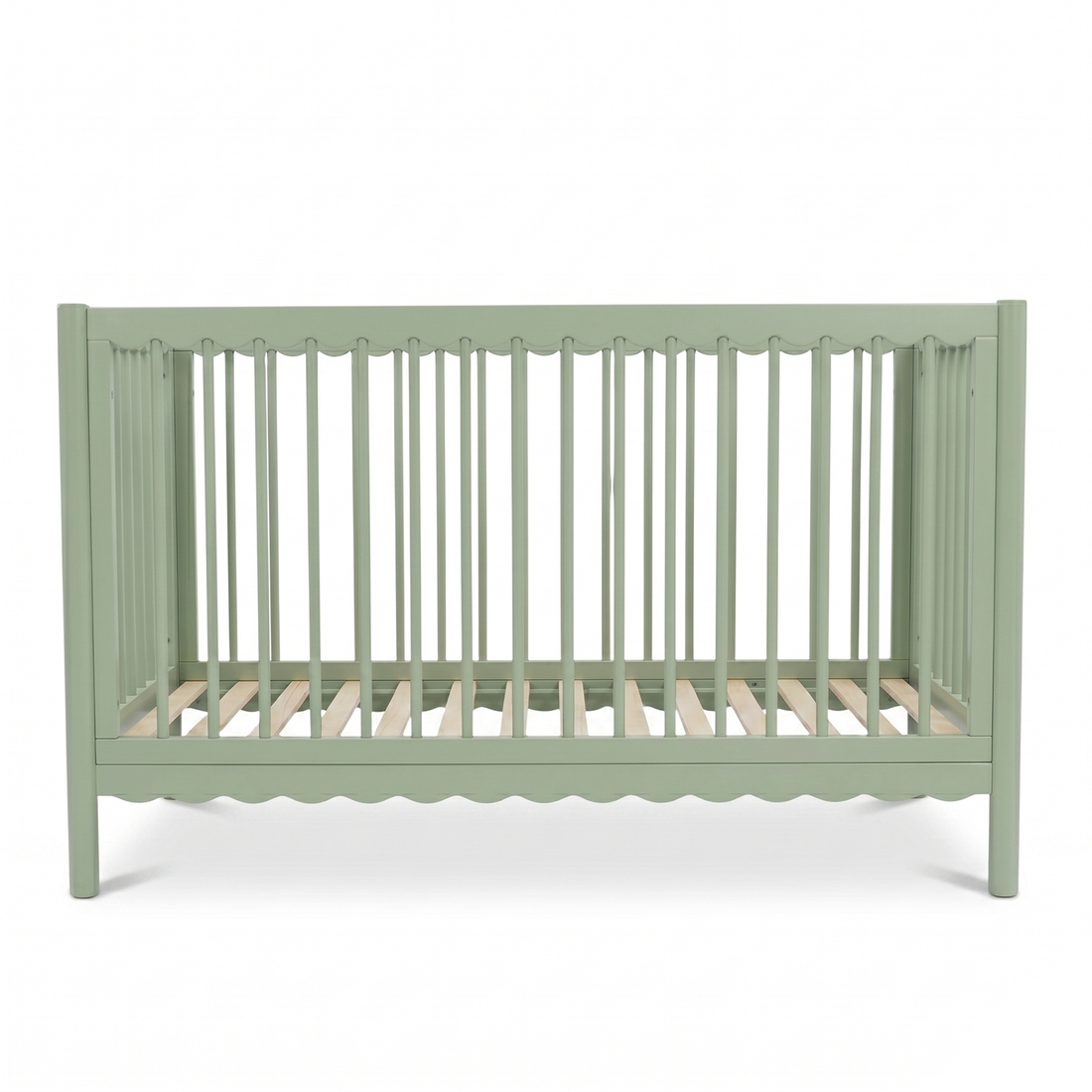 Sage green baby crib on white background highlighting scalloped bottom detail