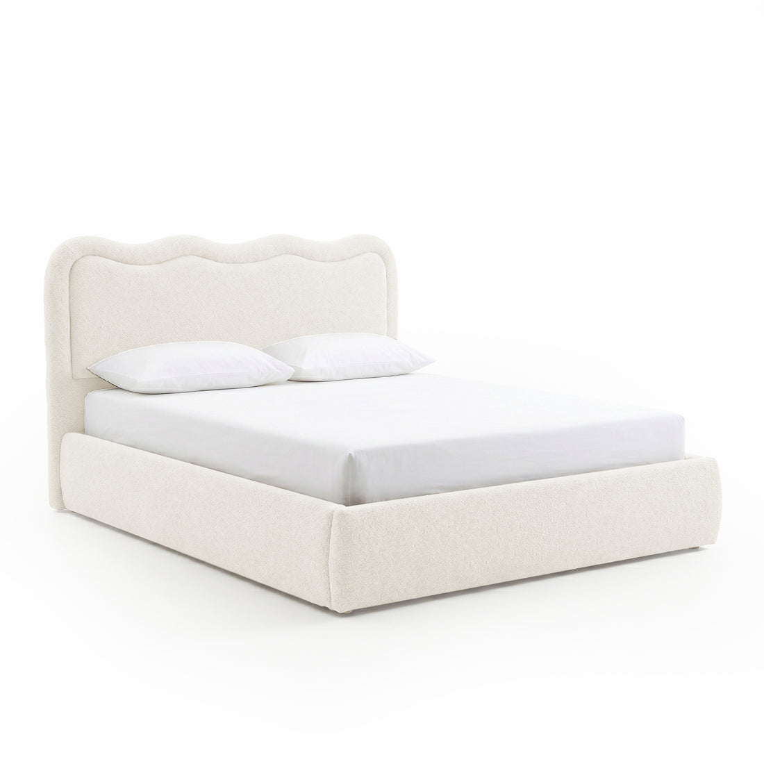 Modern upholstered bed with pillows on white background