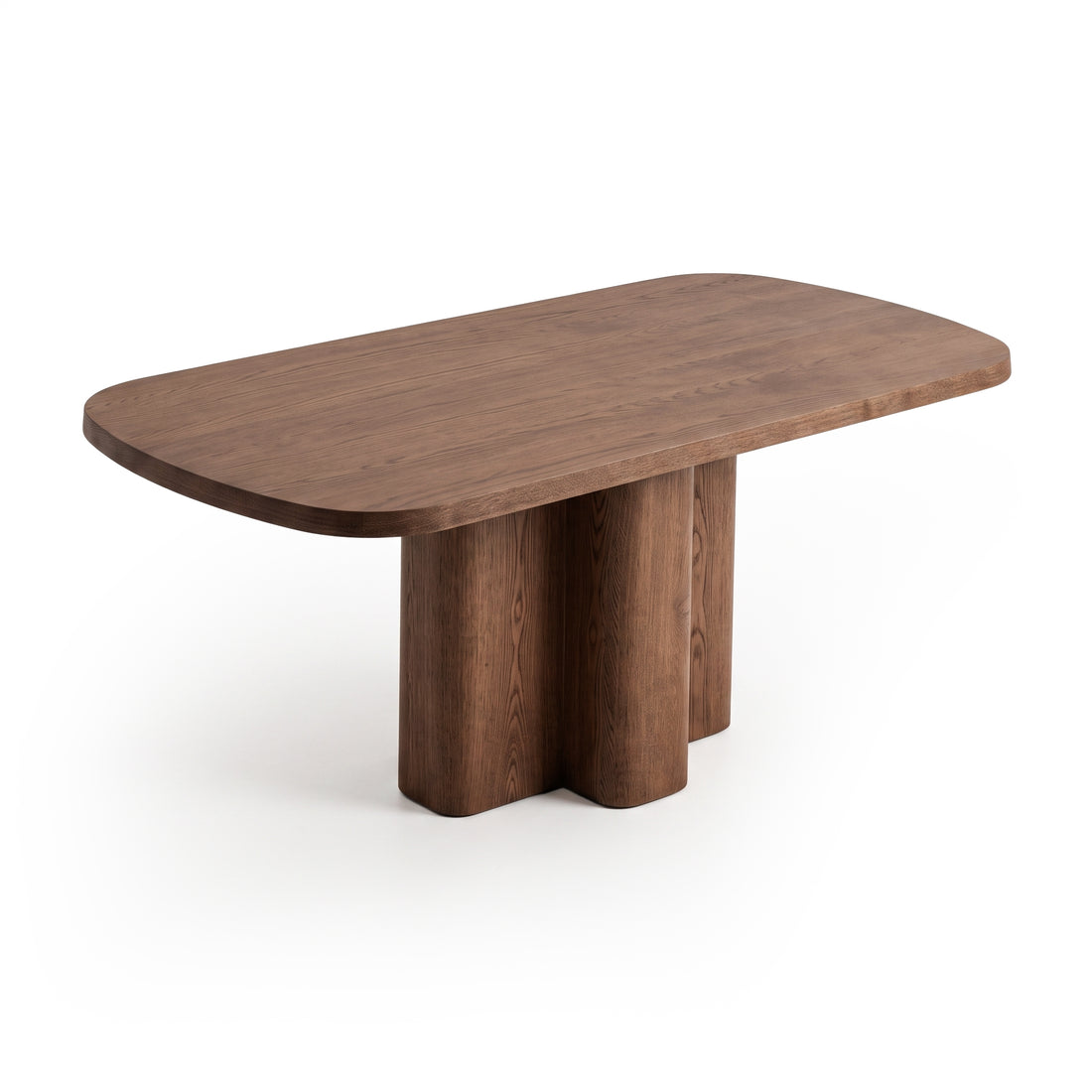Contemporary wooden table with rounded corners and sculptural base on a white background.