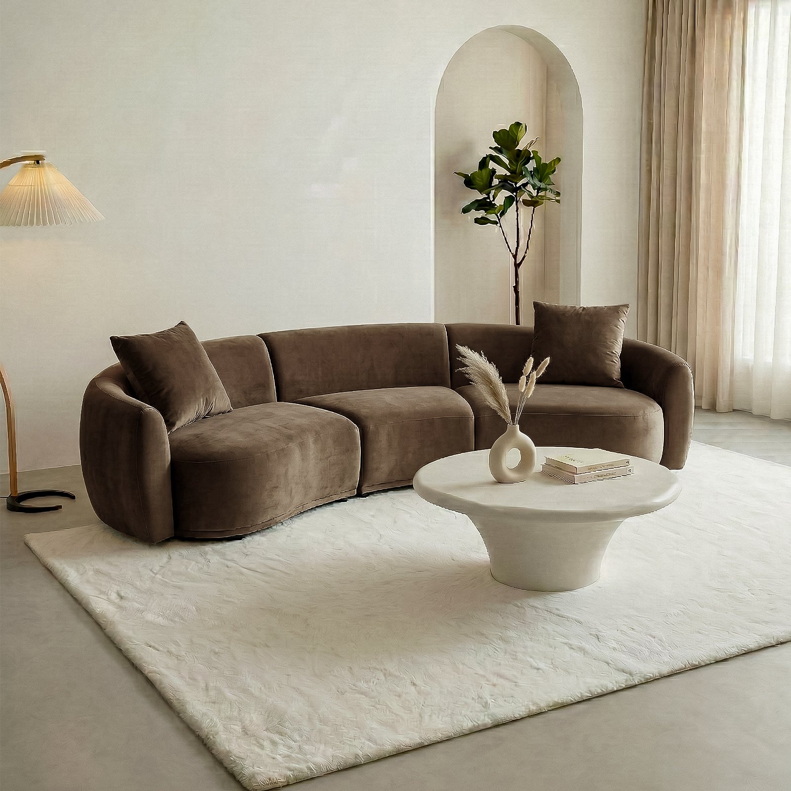 Modern living room with curved brown sofa