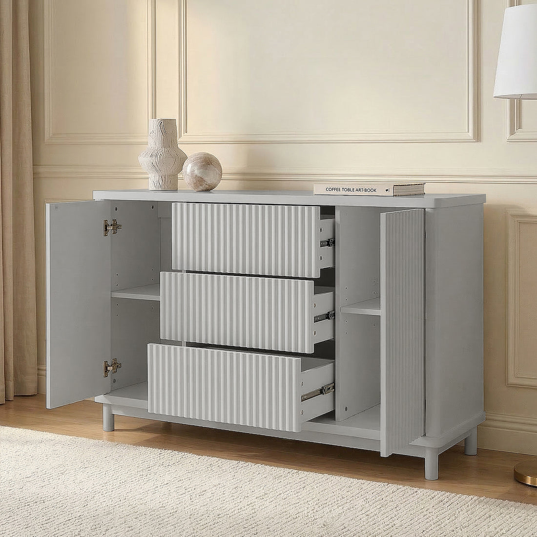 Open light gray cabinet drawers in a styled room