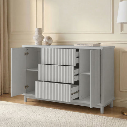 Open light gray cabinet drawers in a styled room
