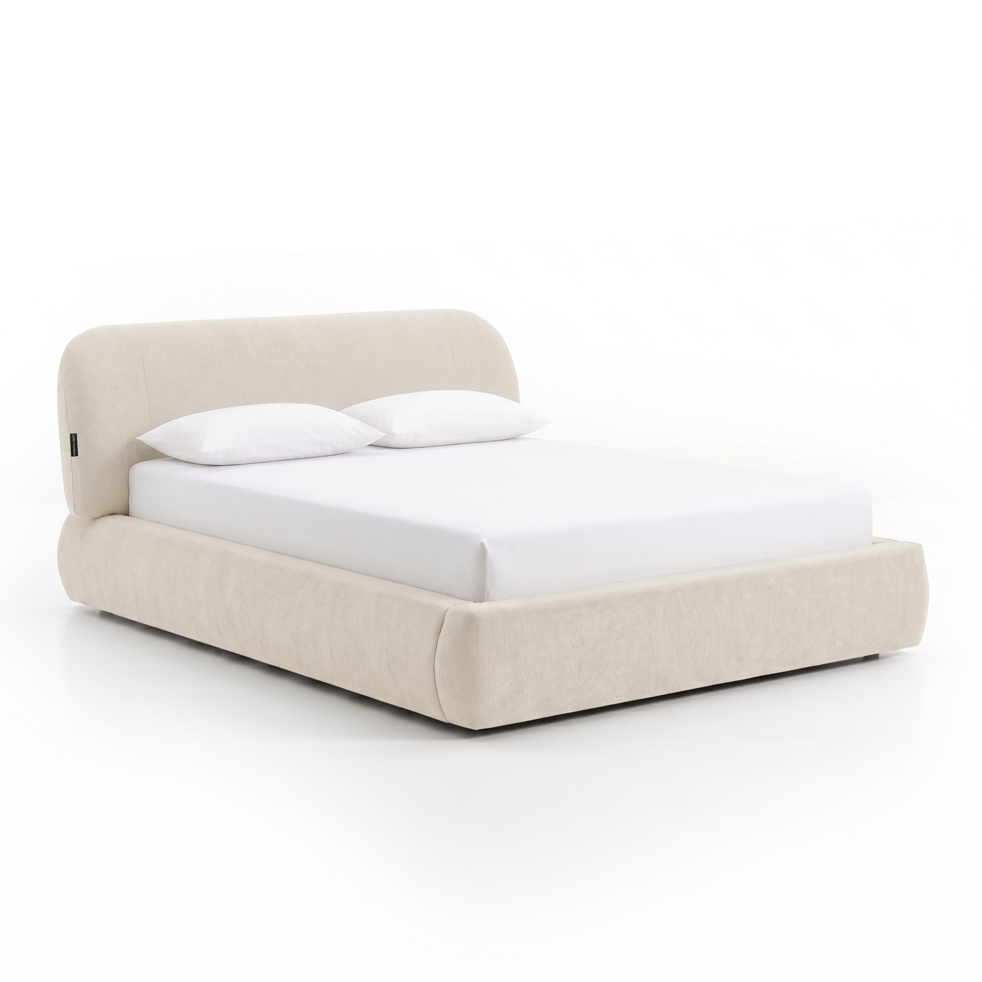 Cream upholstered bed with pillows shown on a white background