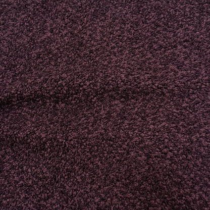 Close-up of plum textured fabric upholstery