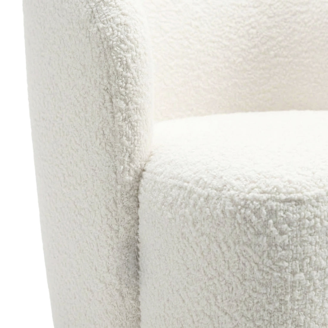 Close-up of white textured upholstered chair fabric and curved arm