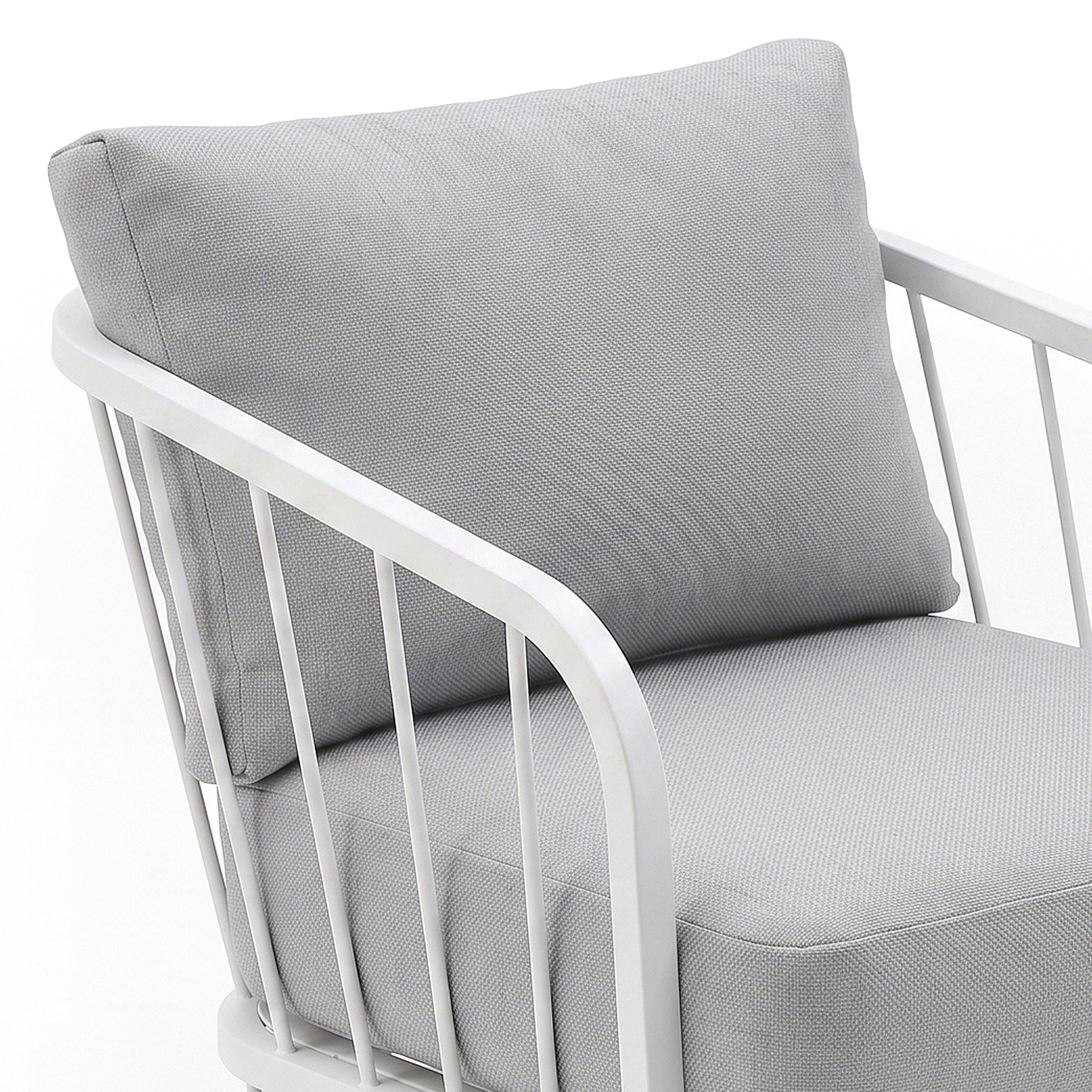 Close-up of a chair seat and back with white metal frame on a white background