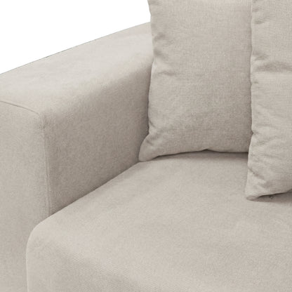 Close-up of sofa armrest and cushions on white background