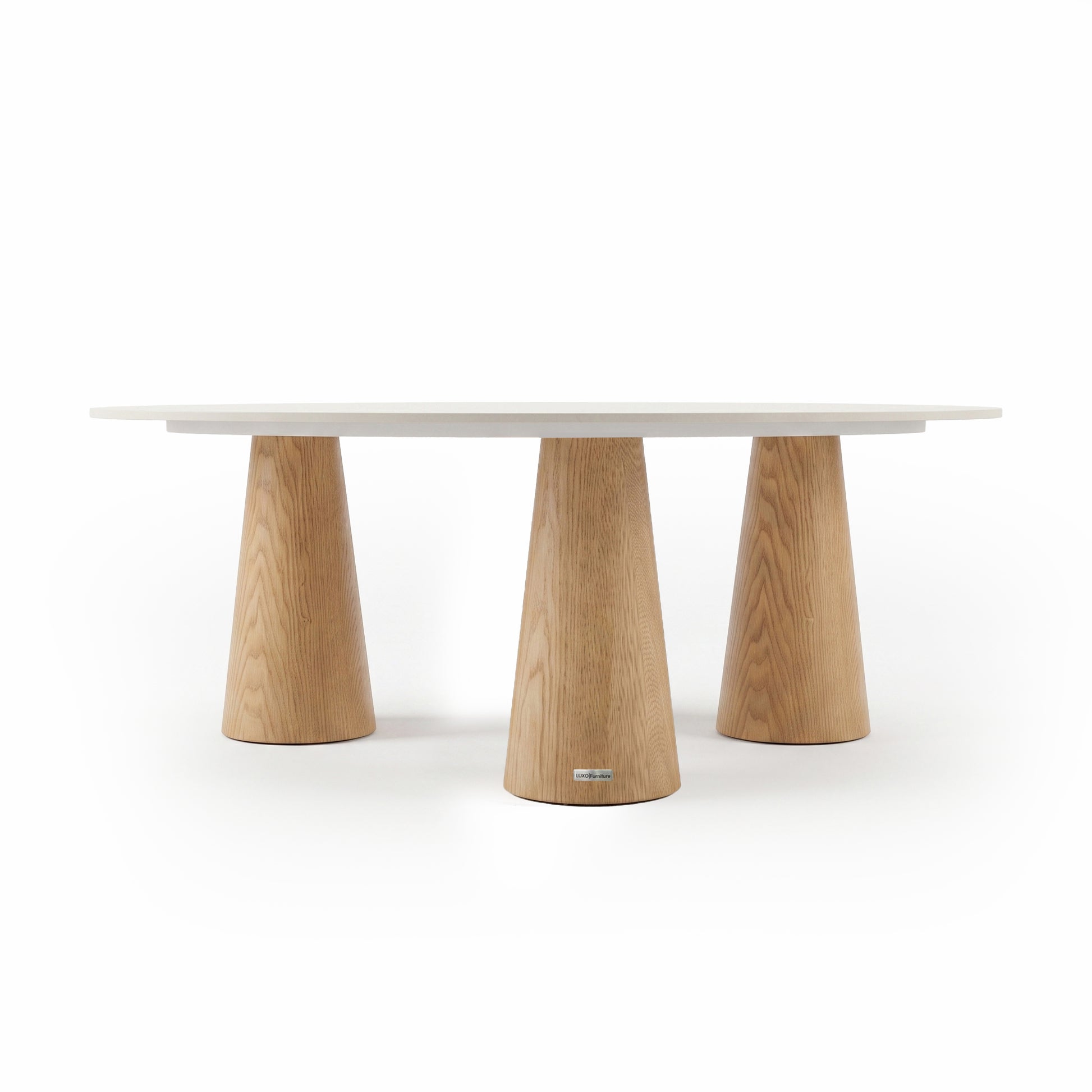 Modern oval table with white top and three tapered wooden legs on a white background