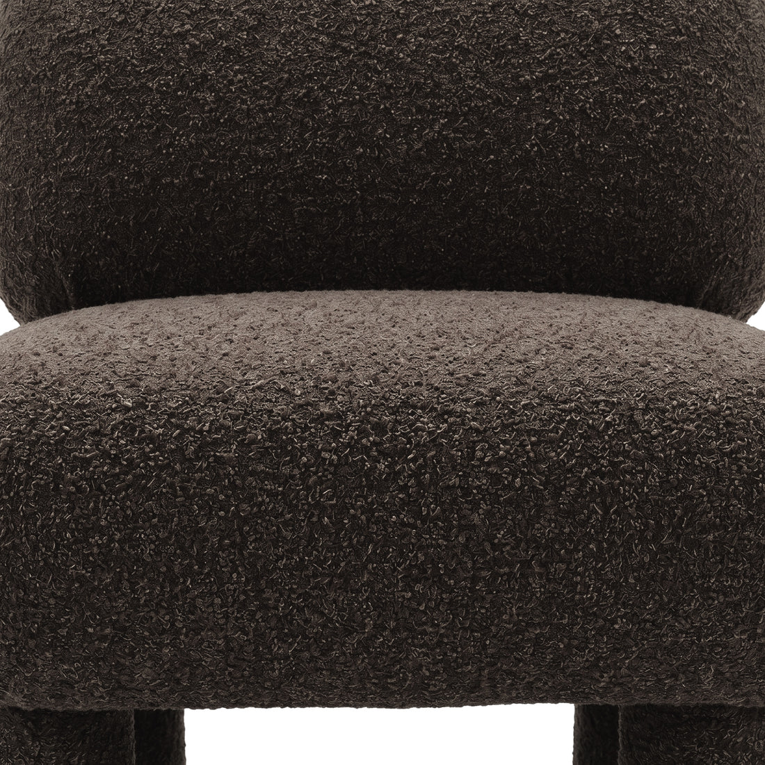 Detail of boucle upholstery on chair seat and backrest