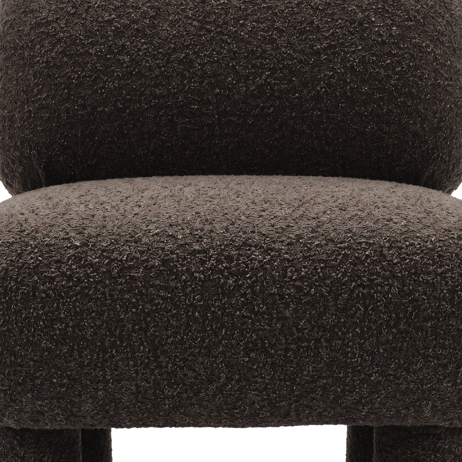 Detail of boucle upholstery on chair seat and backrest