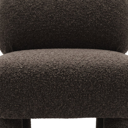 Detail of boucle upholstery on chair seat and backrest