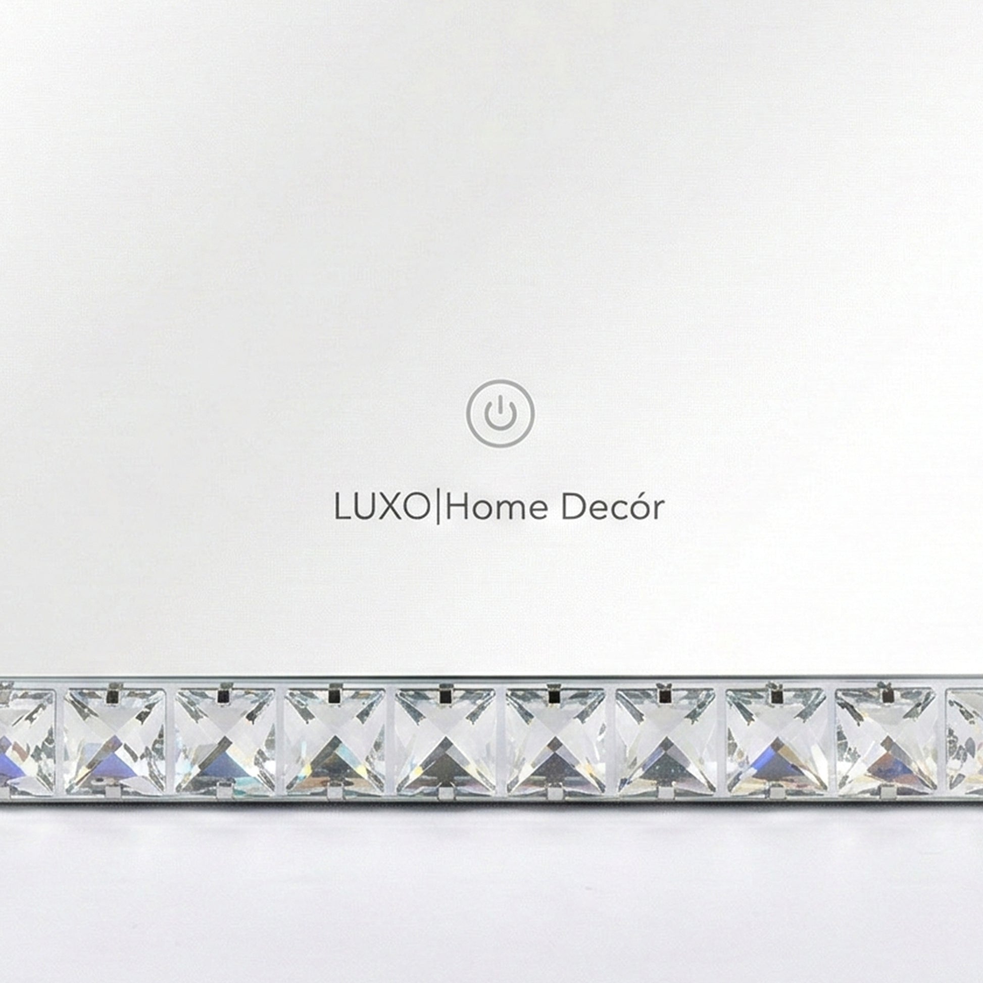 Close-up of mirror border with LUXO Home Décor branding and touch icon