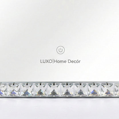 Close-up of mirror border with LUXO Home Décor branding and touch icon