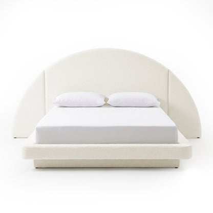 Full modern upholstered bed with arched headboard on a white background